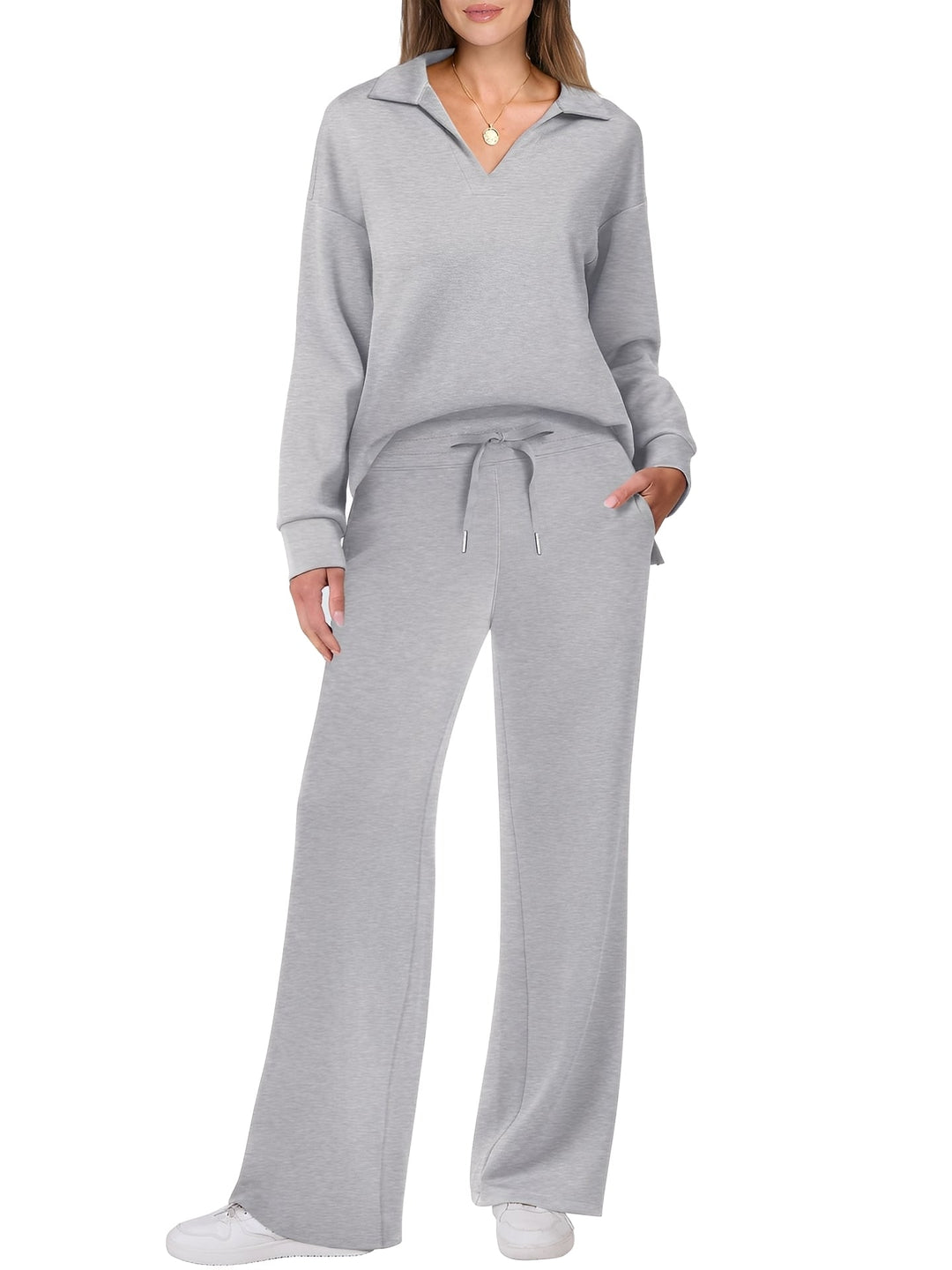 Conjunto casual feminino com suéter e calças, tendência de moda para um look versátil e confortável de outono.