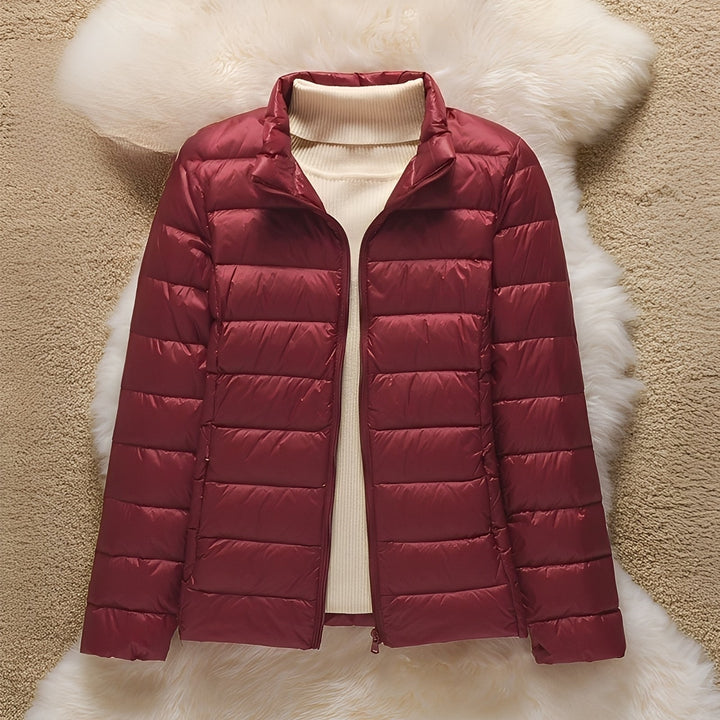 Jaqueta acolchoada feminina Milani sem capuz, peça essencial para looks de outono e inverno.