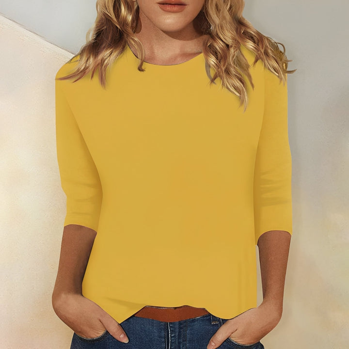 Blusa casual feminina solta e confortável com manga 3/4, essencial para um visual relaxado.