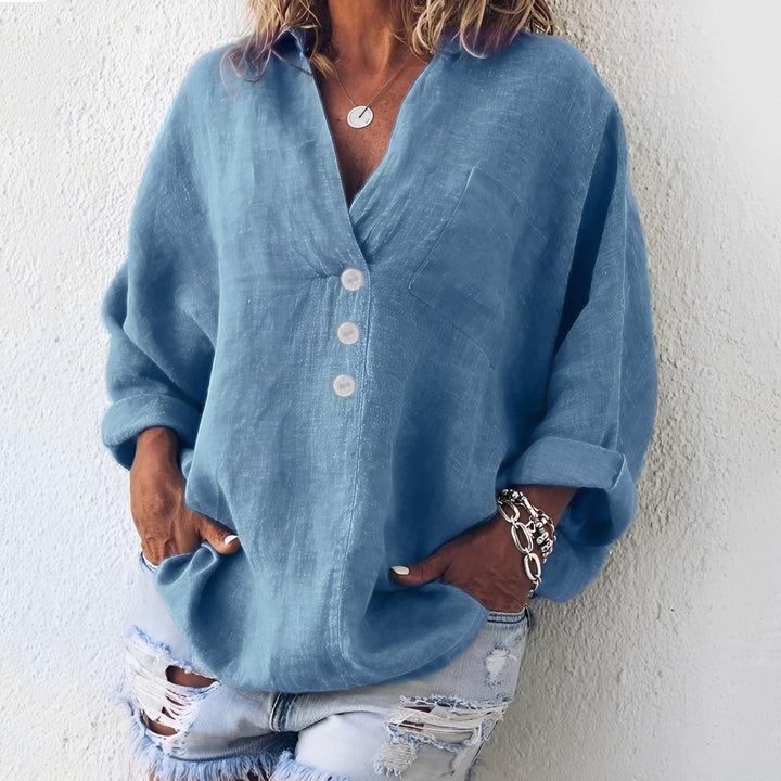 Blusa feminina de manga longa, estilo casual-elegante. Ideal para moda outono/primavera, oferece conforto e versatilidade.