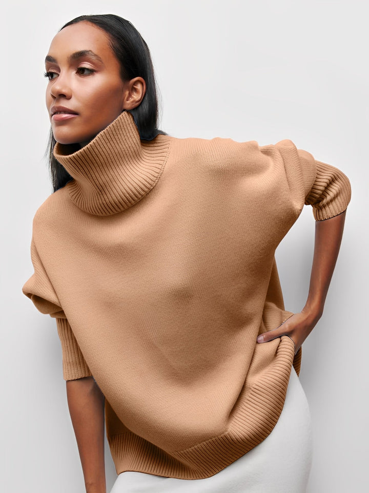 Suéter feminino de gola alta elegante, com textura suave, essencial para o guarda-roupa de inverno.