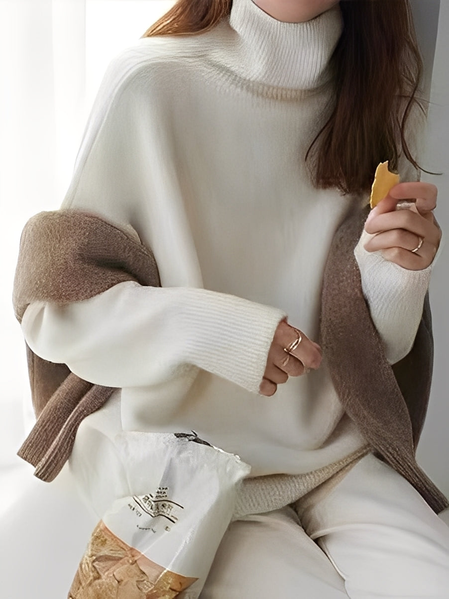 Suéter feminino elegante de malha cinza com gola alta, ideal para o inverno e outono. Caimento solto e confortável.