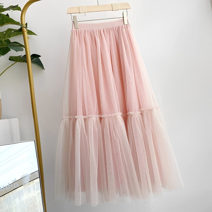 Roupa feminina: saia elegante com babados e cós elástico, estilo romântico e versátil.