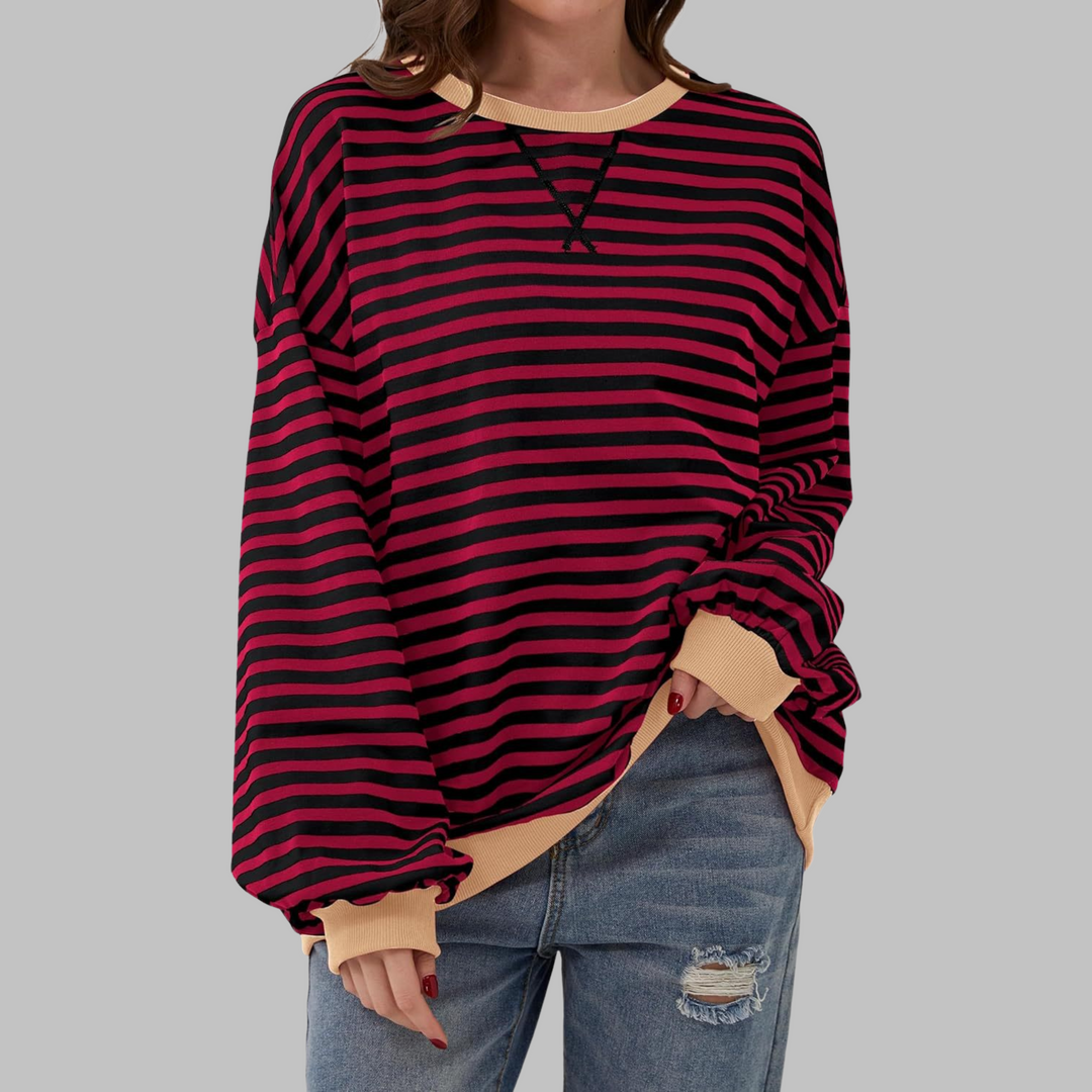 Camisola feminina Malin com padrão listrado, uma peça versátil e confortável para todas as ocasiões.