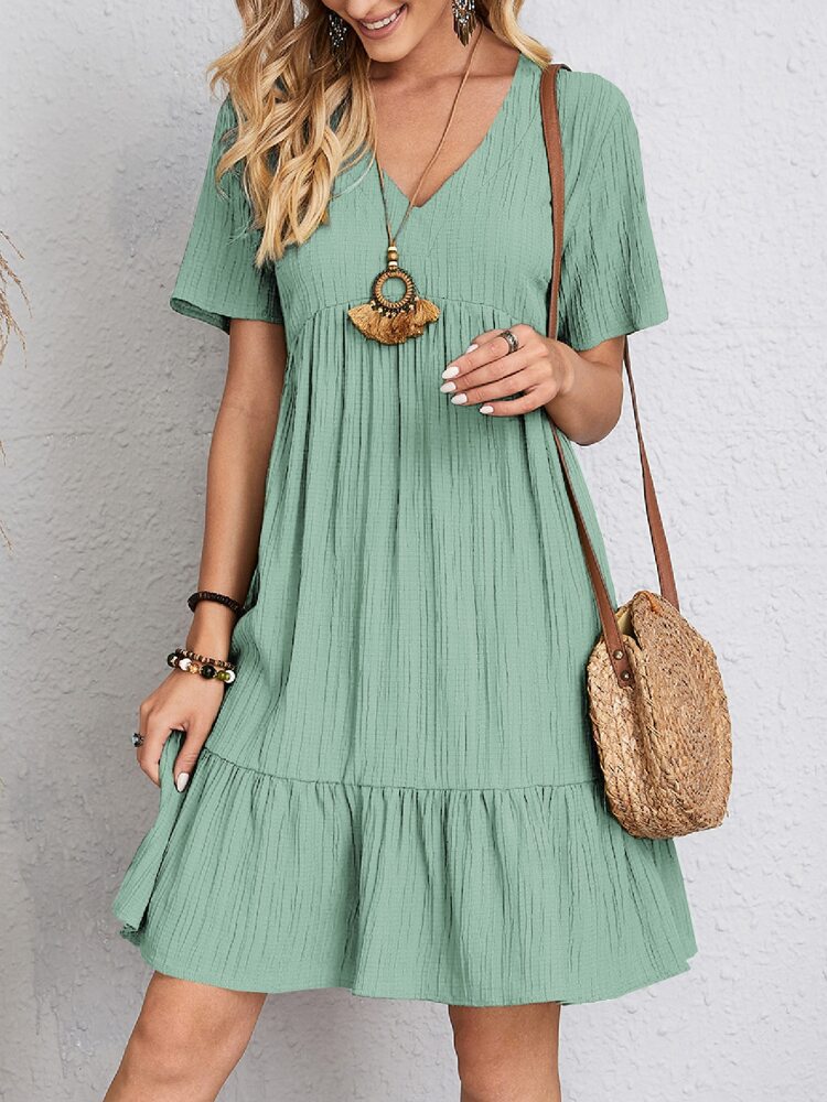 Vestido feminino clássico Rosie com decote V, ideal para verão e moda casual. Elegância e conforto.