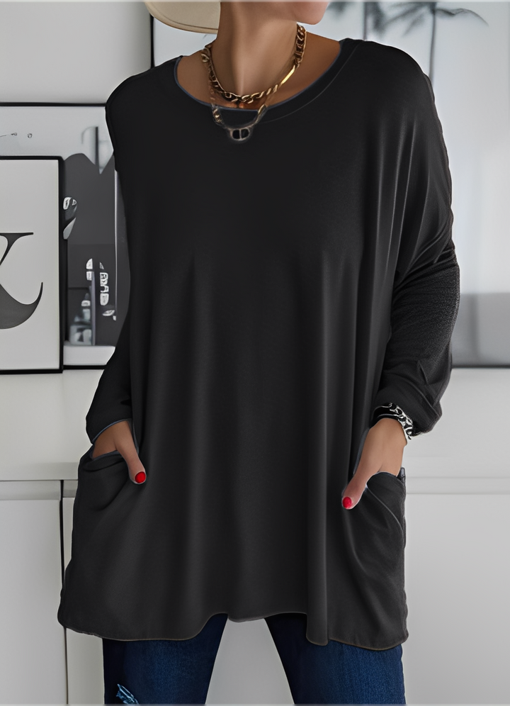 Pulôver feminino solto, oferece conforto superior. Blusa ideal para um look casual e versátil no dia a dia.