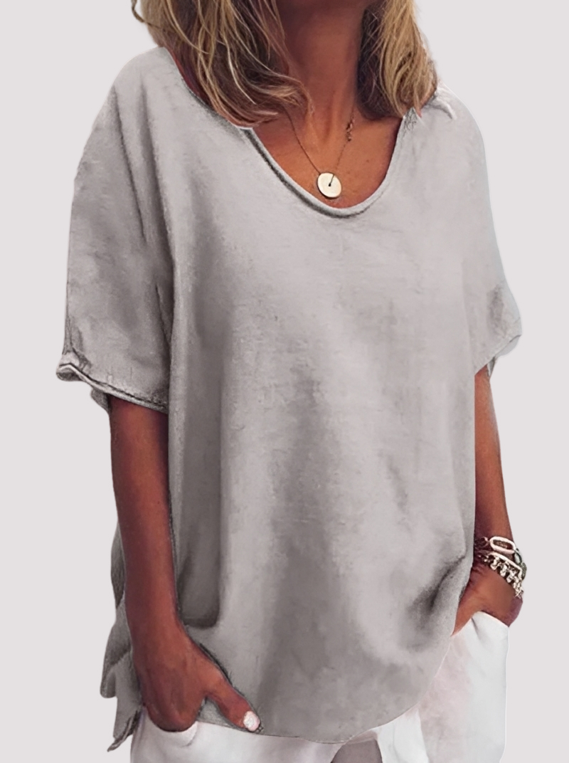 Blusa feminina solta e leve. Top casual de moda para o verão, oferecendo conforto e estilo diário.