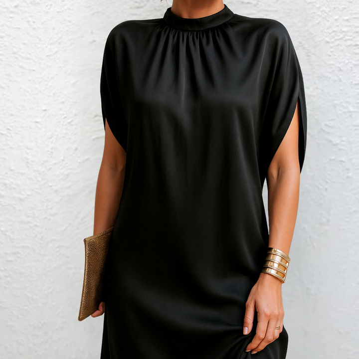 Vestido preto feminino confortável e versátil, perfeito para ocasiões de trabalho, festas ou uso casual.