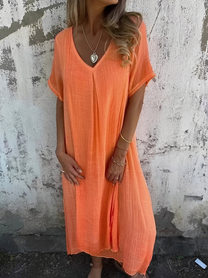 Vestido feminino midi solto e confortável para verão, decote V, casual, ideal para praia ou primavera.