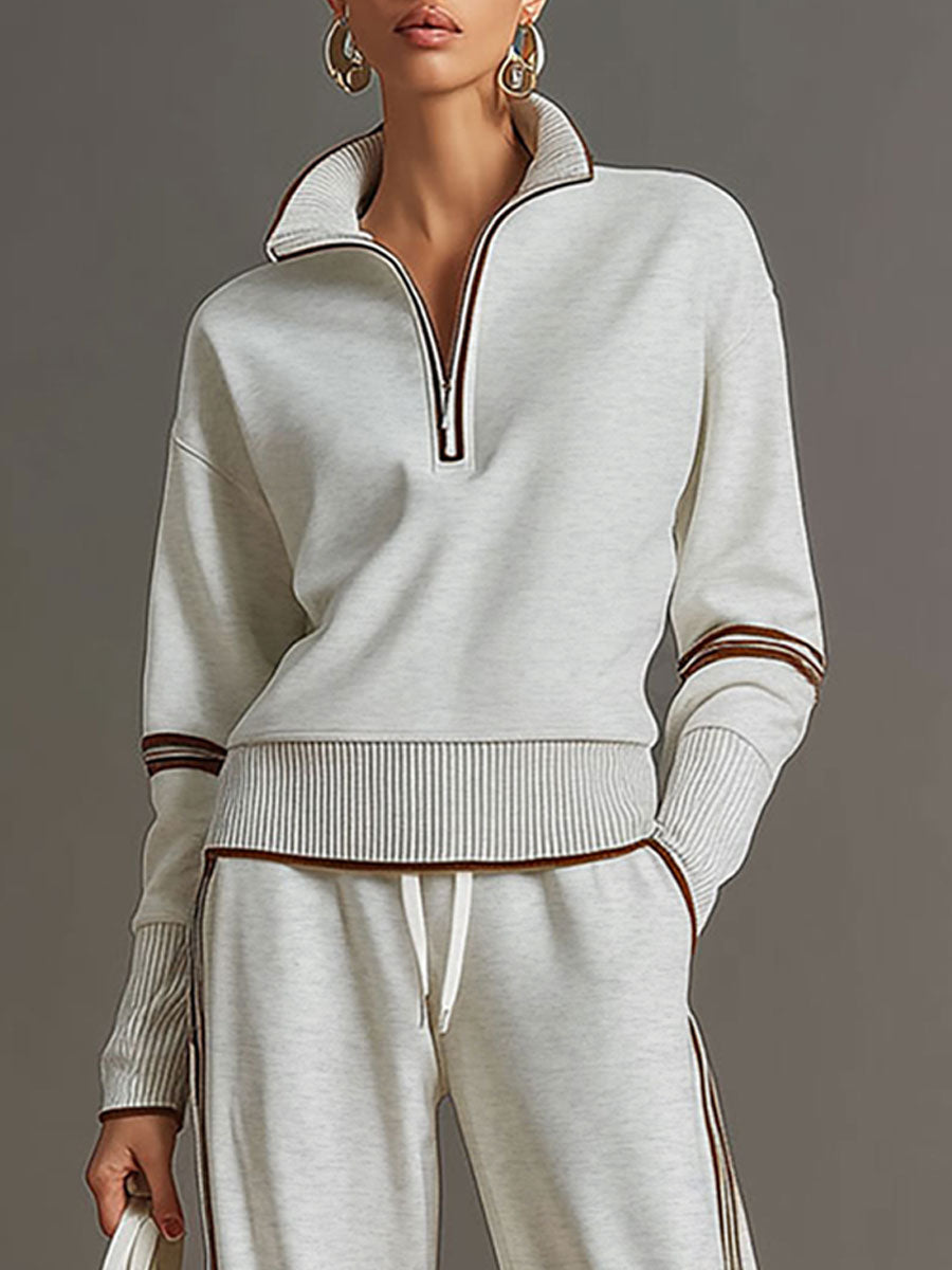 Elegante conjunto de blusa e calças largas Marietta. Roupa feminina casual e de verão.