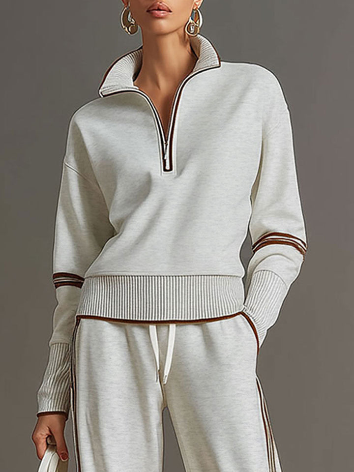 Elegante conjunto de blusa e calças largas Marietta. Roupa feminina casual e de verão.