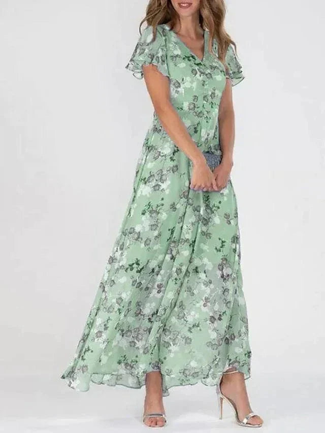 Vestido feminino colorido com cores vibrantes e corte fluido, perfeito para o verão. Conforto e estilo.
