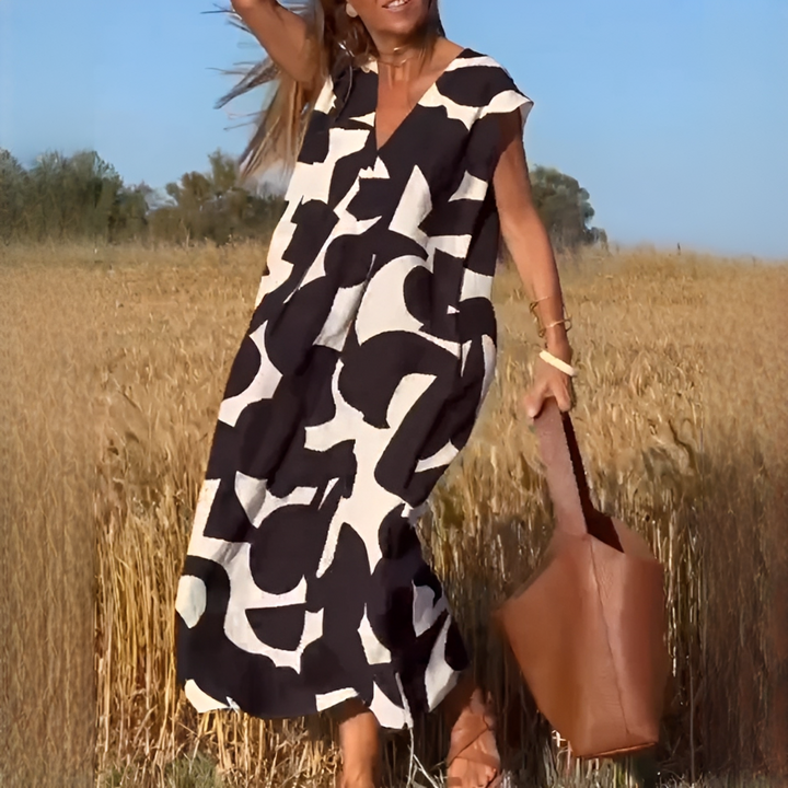 Vestido feminino elegante decote V, corte solto e confortável para verão. Estilo casual e moderno.
