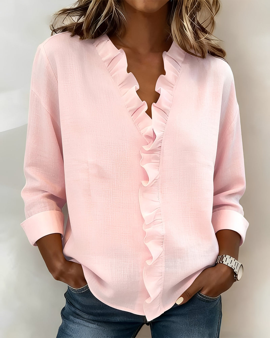 Blusa feminina elegante de manga longa, decote V e babados, ideal para trabalho ou eventos casuais na primavera.