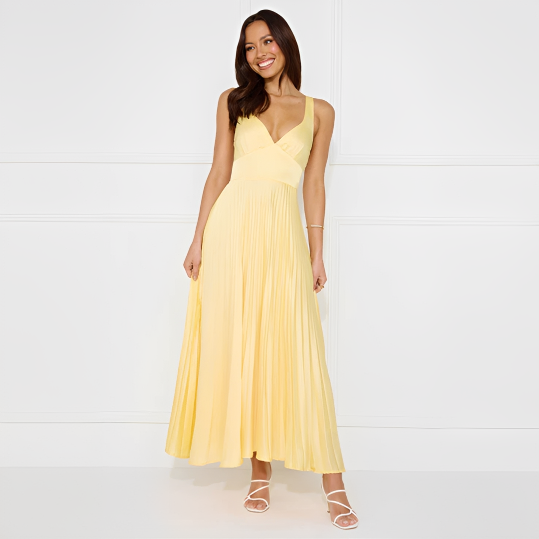 Vestido feminino longo elegante amarelo com saia plissada, perfeito para festa e ocasiões especiais. Moda verão sem mangas.