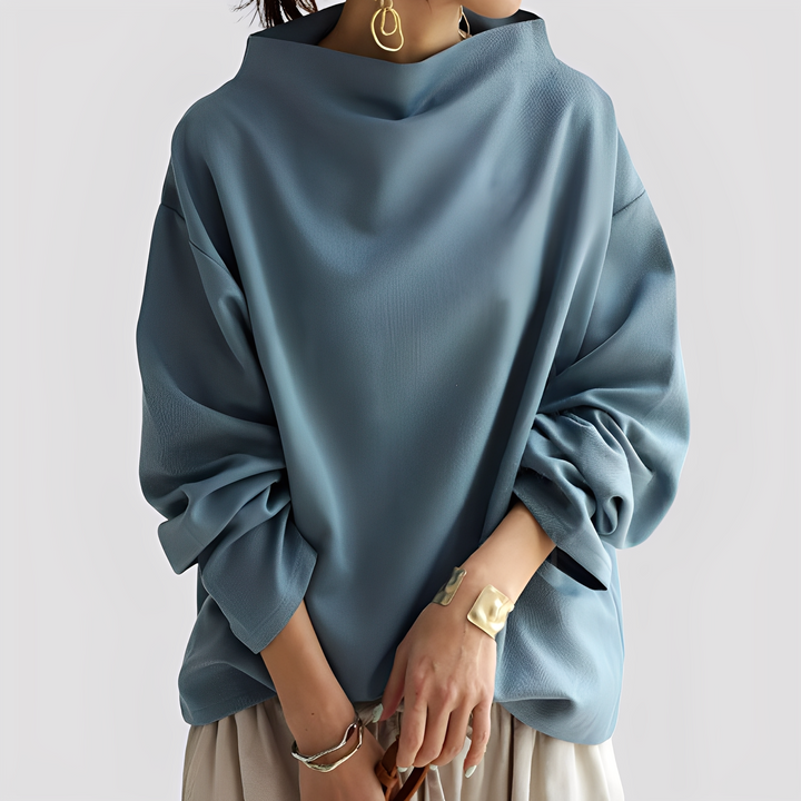 Suéter feminino de manga comprida, corte solto e casual, peça versátil para moda e bem-estar no inverno.