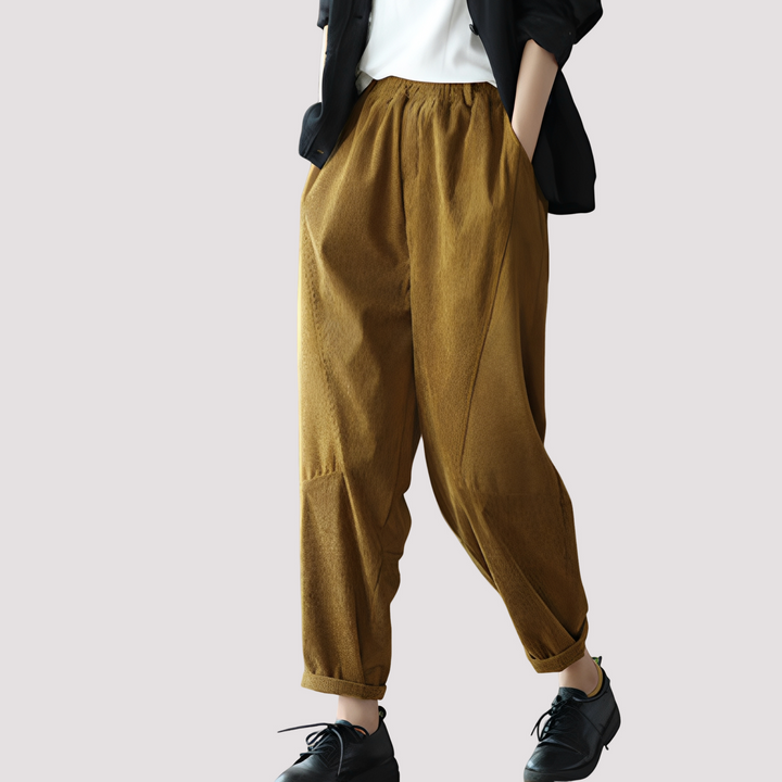Roupa feminina de verão: calça harém casual verde, com cós elástico e estilo descontraído para o dia a dia.