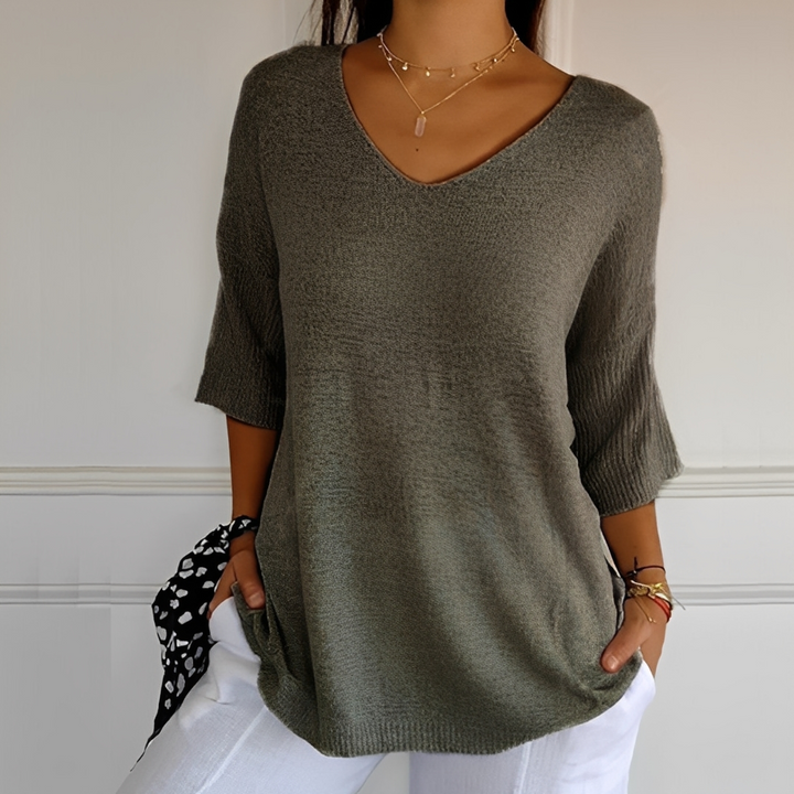 Suéter feminino longo Melodia, com toque macio e caimento elegante. Blusa confortável.