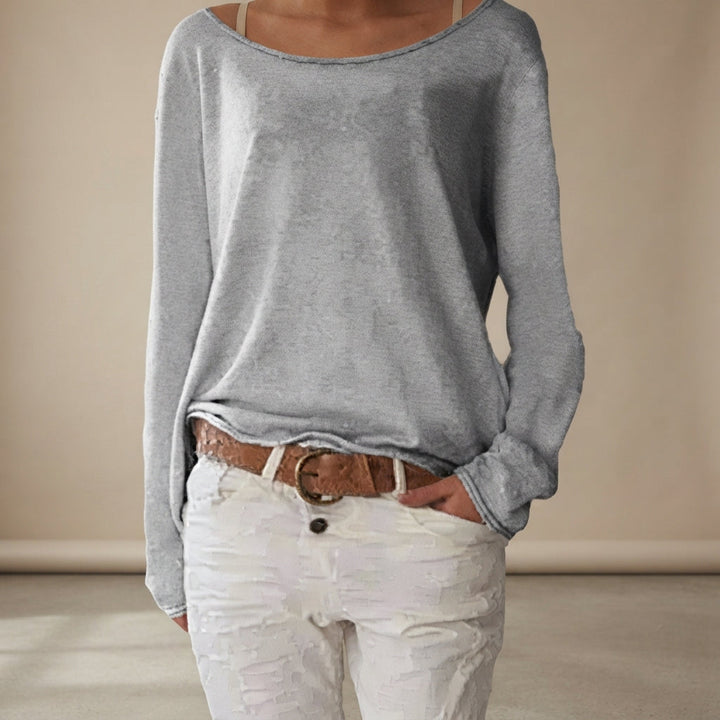 Camisa feminina confortável de corte solto, manga comprida, ideal para um visual casual e elegante.