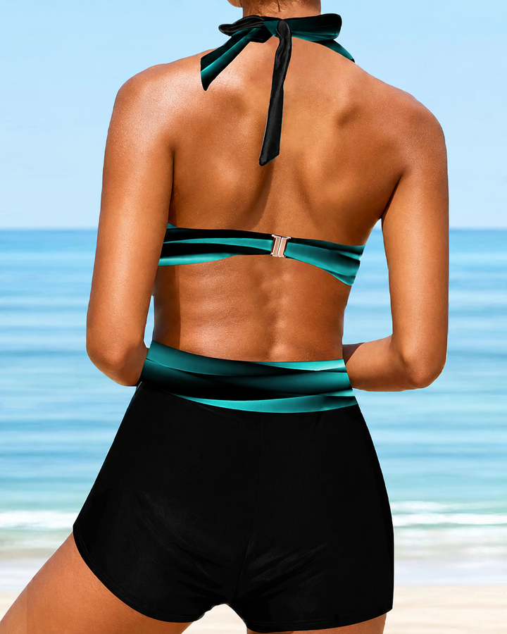 Tankini feminino moderno com design de gola halter cruzada, para um look elegante na praia, piscina ou verão.