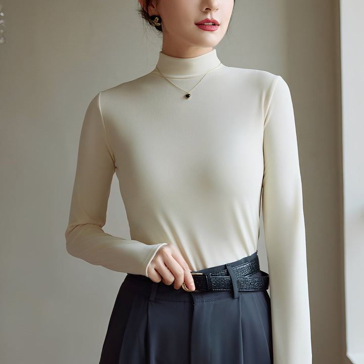 Top feminino elegante de gola alta para outono inverno, ideal para conforto diário e looks de trabalho.