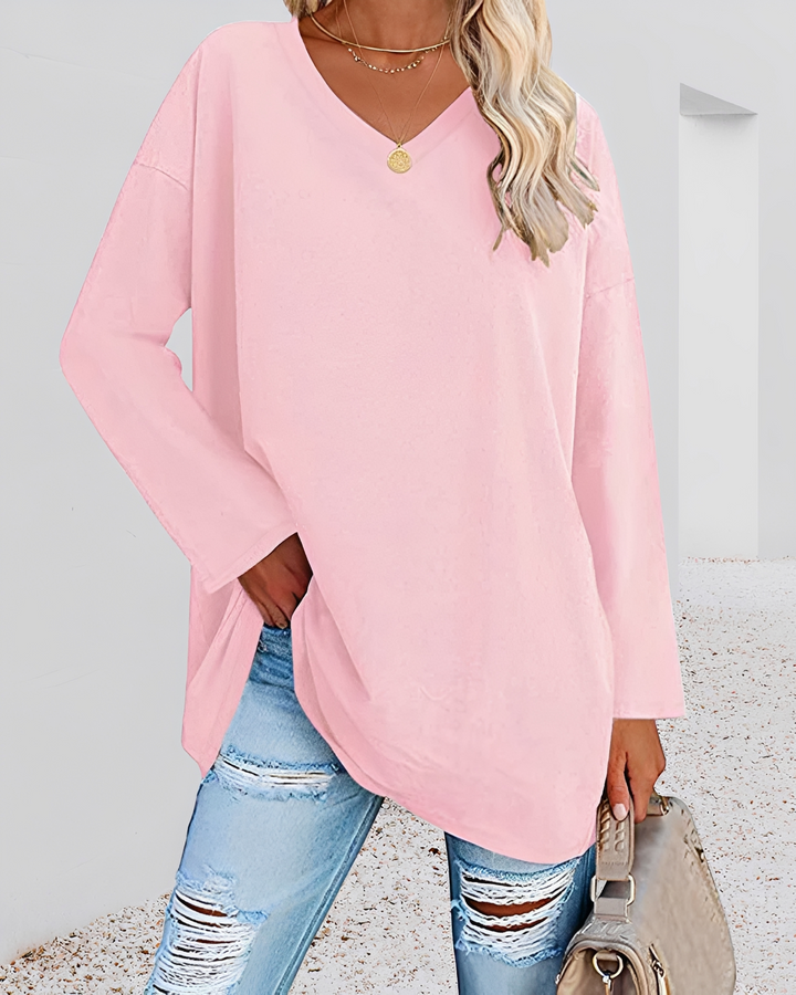 Camisa solta feminina, decote V, que oferece conforto e elegância. Essencial para moda feminina moderna.