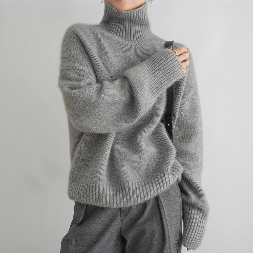 Agasalho feminino de inverno, suéter gola alta para conforto e moda. Peça versátil e elegante para dias frios.
