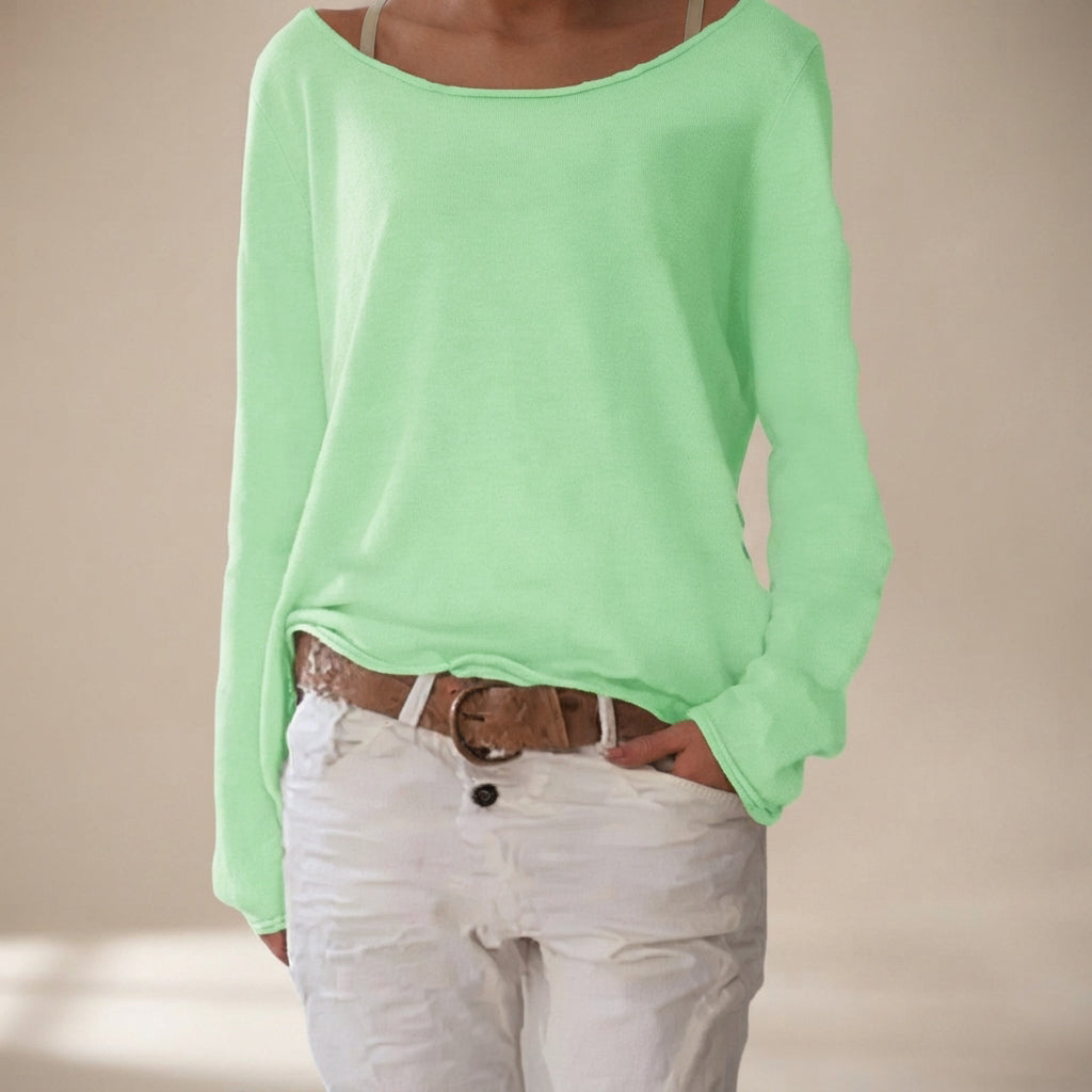 Camisa feminina elegante para o dia a dia, com corte solto e manga comprida, unindo casualidade e conforto.
