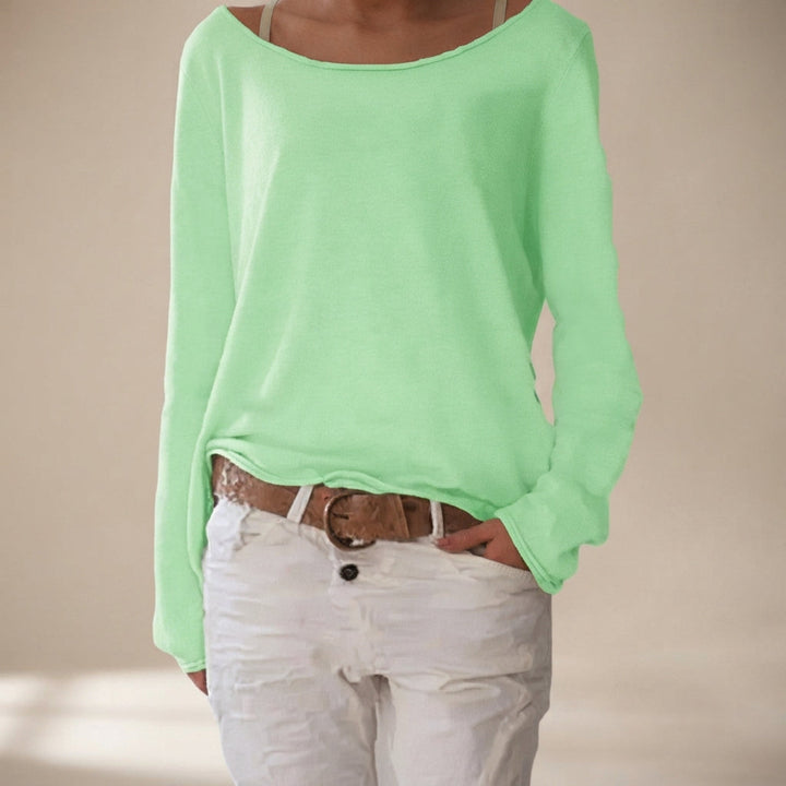 Camisa feminina elegante para o dia a dia, com corte solto e manga comprida, unindo casualidade e conforto.