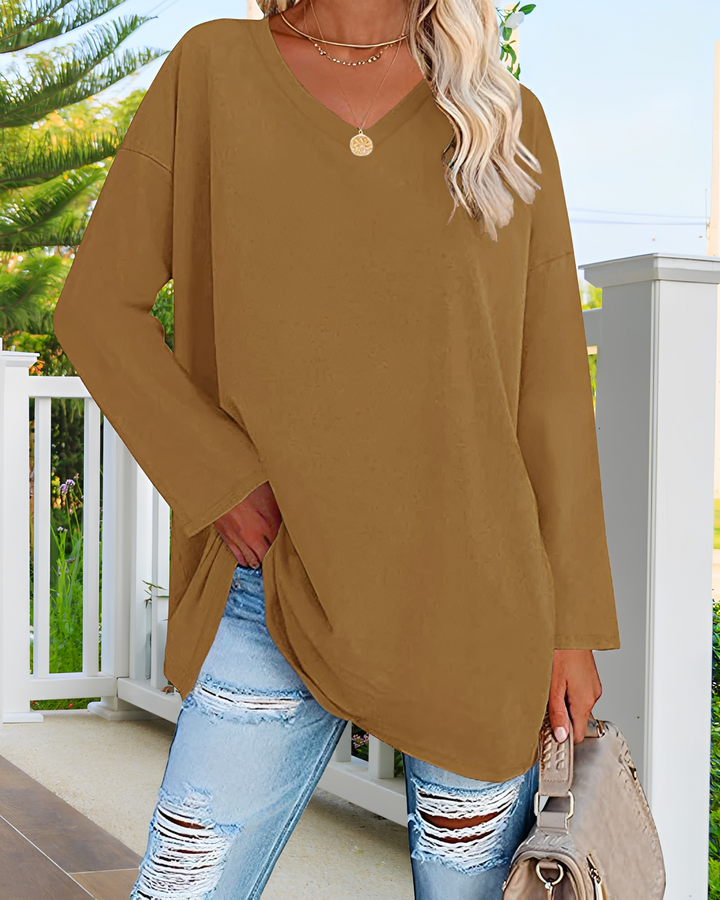 Blusa feminina de manga longa e caimento solto, decote V elegante, ideal para o dia a dia versátil.