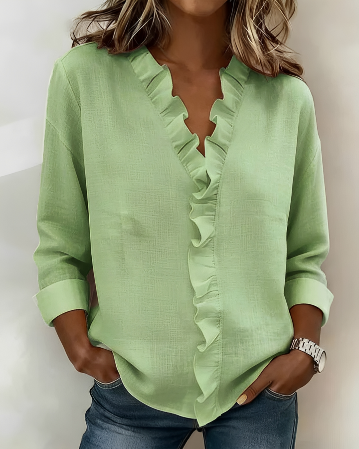 Blusa feminina elegante com decote V e babados, manga longa. Ótima para looks de trabalho ou passeios casuais.