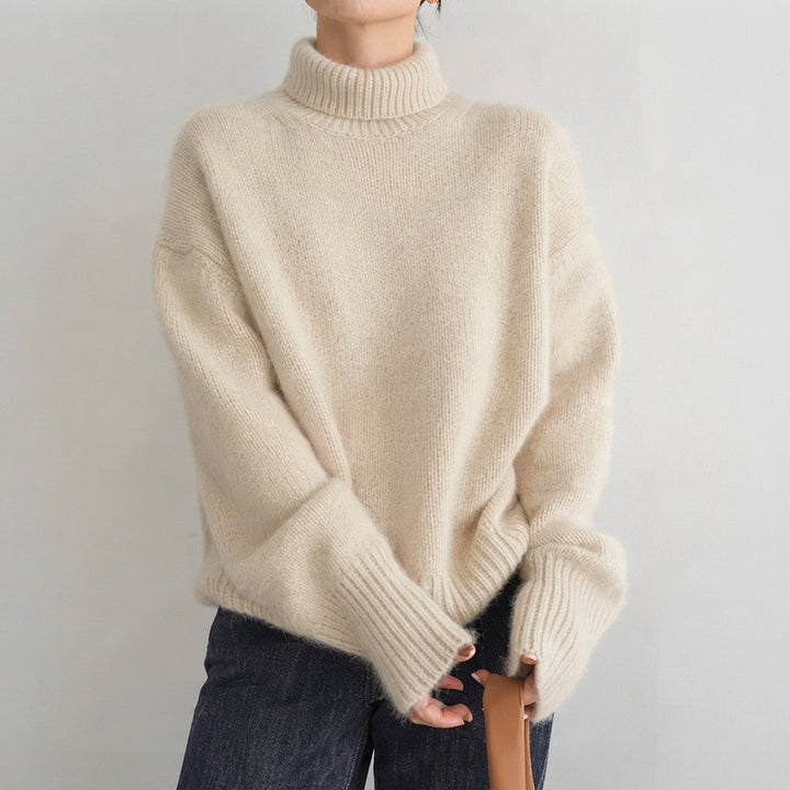 Suéter feminino de gola alta elegante em tricot, ideal para o inverno e outono, oferecendo conforto e estilo versátil.