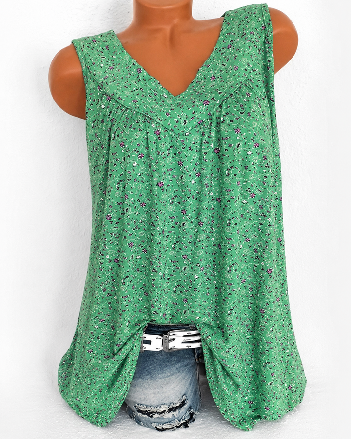 Top fluido feminino estampado, sem mangas, com decote V. Ideal para moda casual de verão.