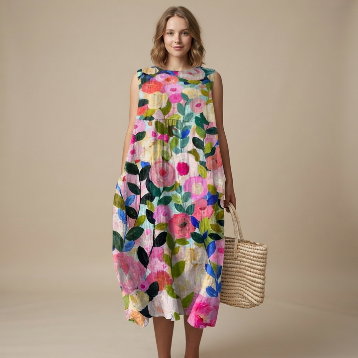 Vestido feminino midi para praia, sem mangas, fluido e confortável. Ideal para o verão e momentos casuais.