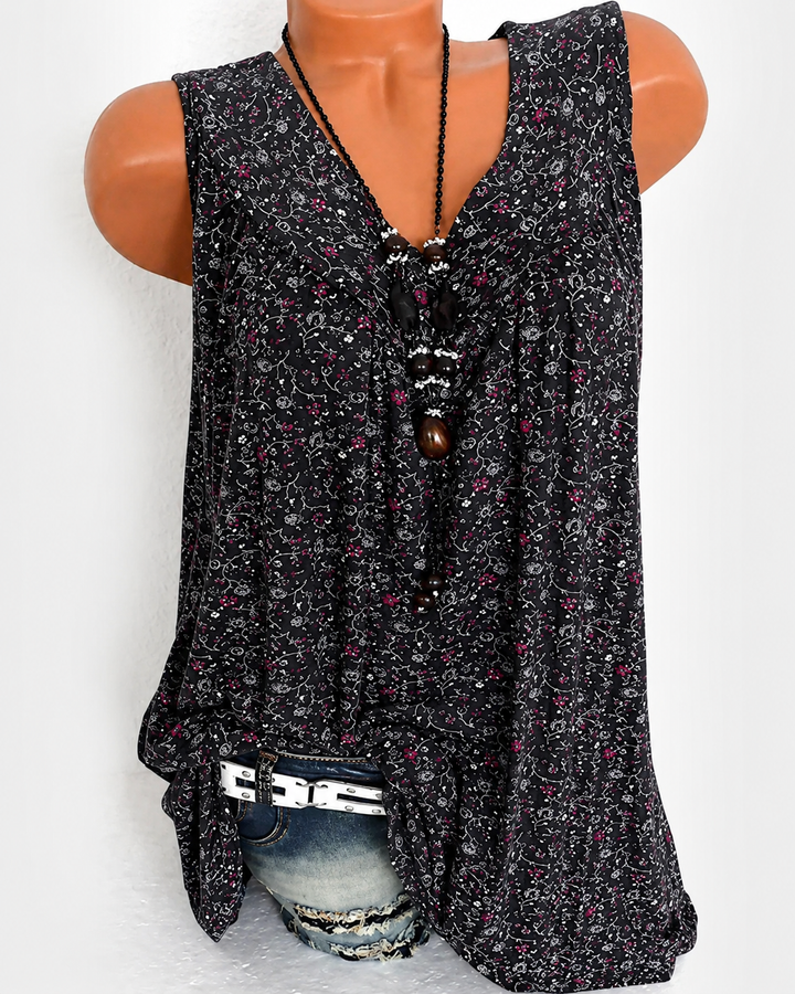 Top fluido feminino leve e elegante, sem mangas, com estampa moderna para o verão.