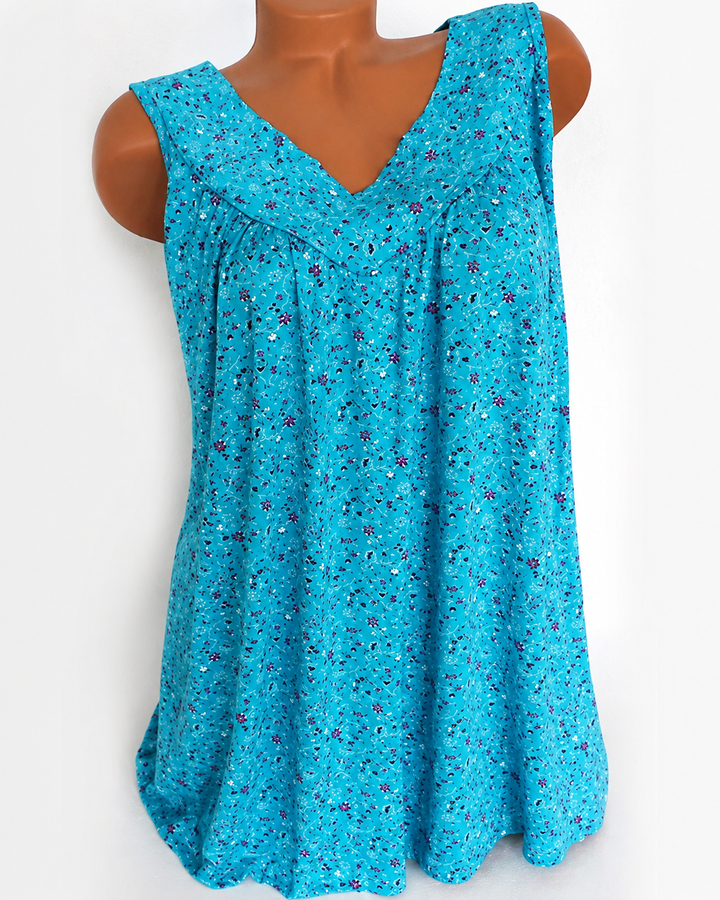 Top feminino estampado fluido, sem mangas, com decote V. Perfeito para look casual de verão.