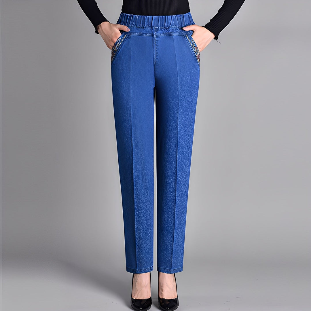 Calça feminina básica azul, cintura elástica, perna reta. Conforto e estilo casual versátil para uso diário em verão/inverno.
