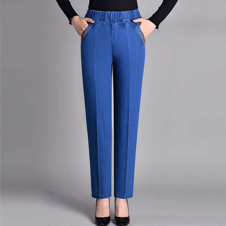 Calça feminina básica azul, cintura elástica, perna reta. Conforto e estilo casual versátil para uso diário em verão/inverno.