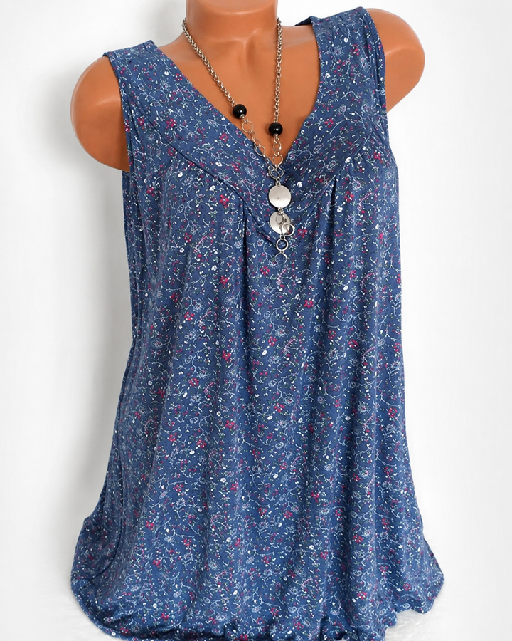 Top fluido feminino sem mangas para o verão. Decote V e estampa. Moda fresca e casual.