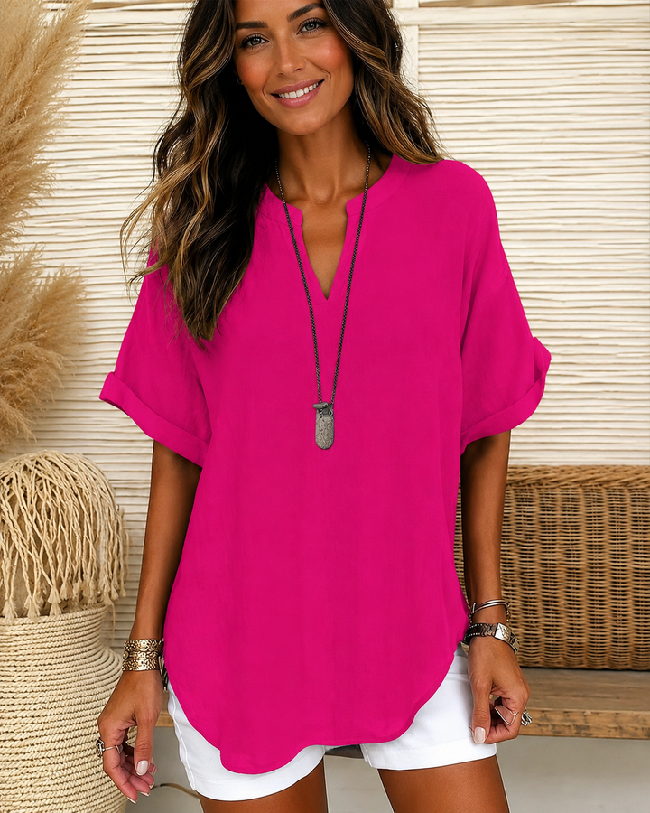 Blusa feminina colorida solta com decote em V. Top elegante e versátil para o dia a dia.
