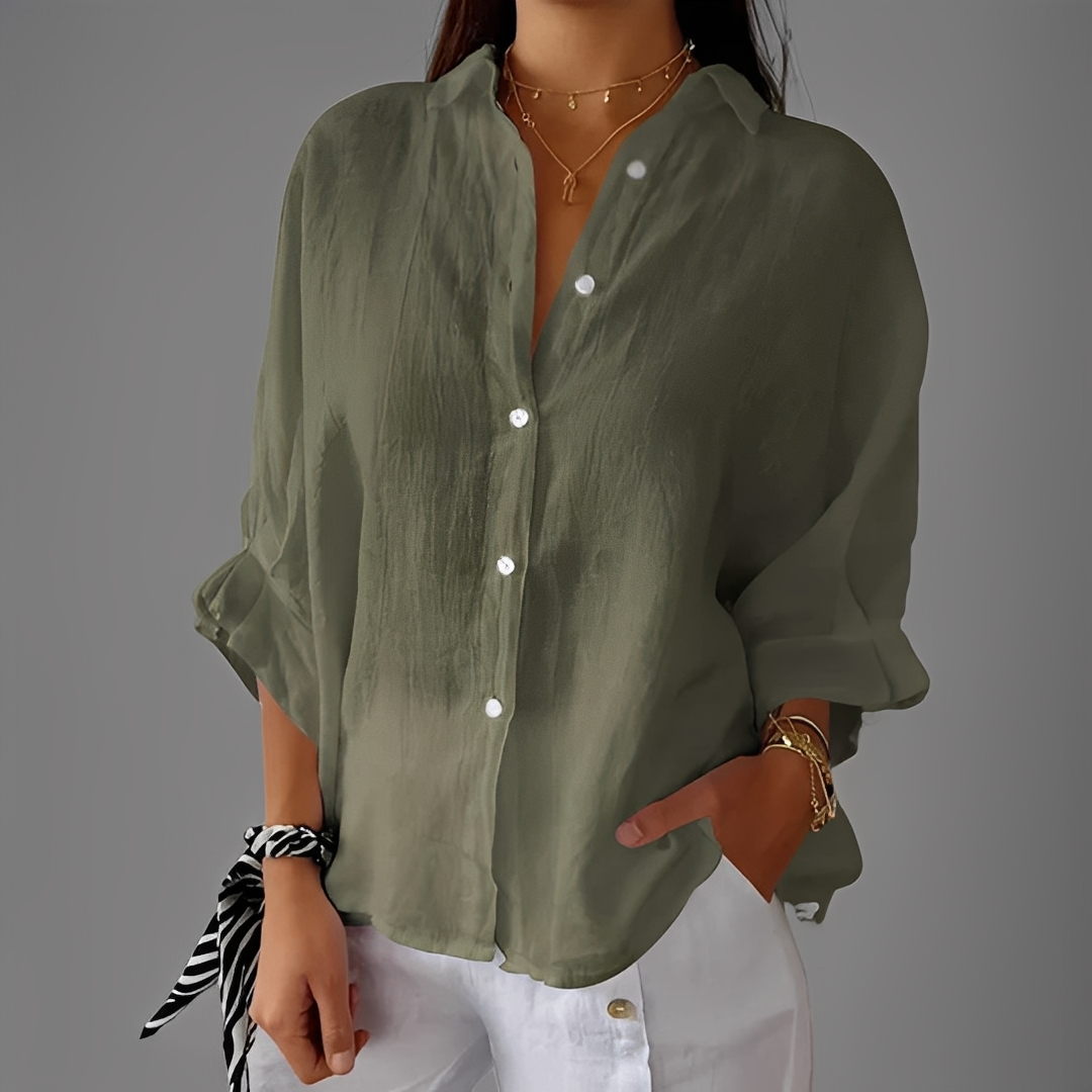 Blusa feminina versátil manga longa. Perfeita para primavera e outono, combina conforto e estilo clássico abotoado.