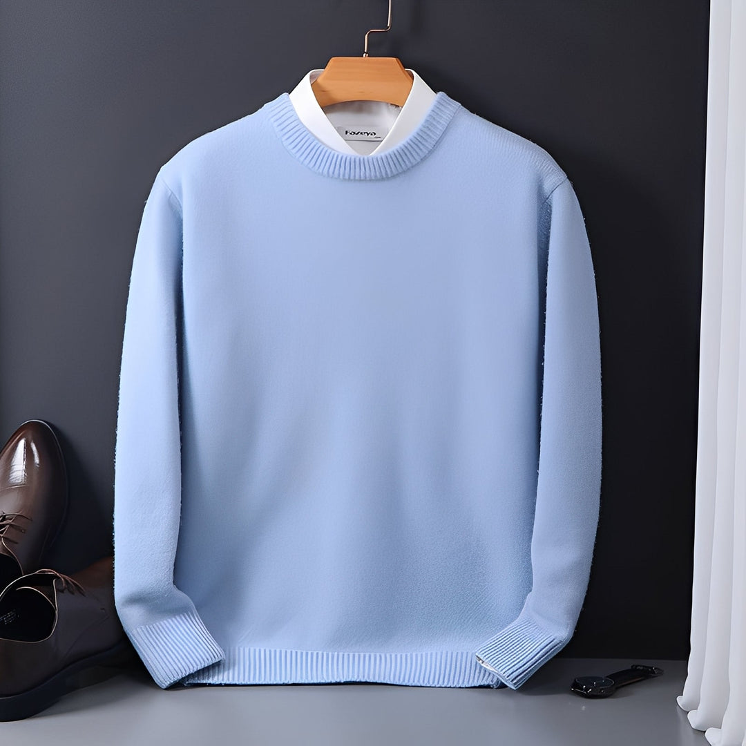 Detalhe da textura do suéter masculino em malha macia, confortável. Peça de moda masculina elegante e versátil.