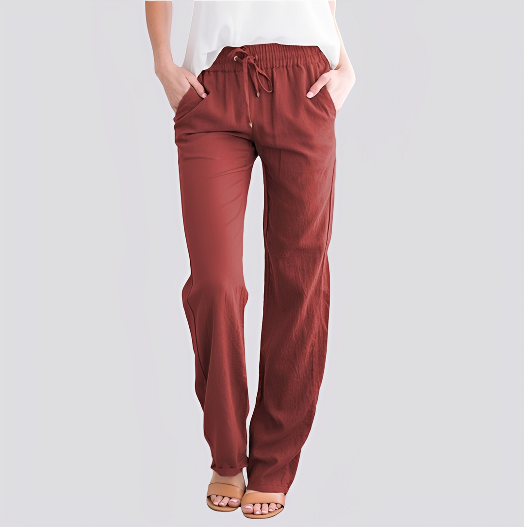 Calça solta feminina casual de cós elástico, detalhe do caimento leve e confortável.