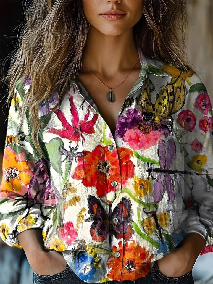 Blusa feminina colorida, manga longa, que combina estilo casual e elegância. Ideal para a moda diária versátil.