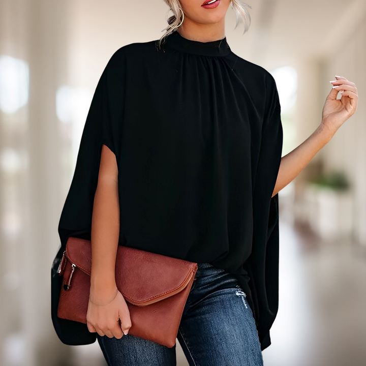 Blusa feminina sofisticada com corte evasê. Ideal para moda verão, looks casuais ou mais elegantes.