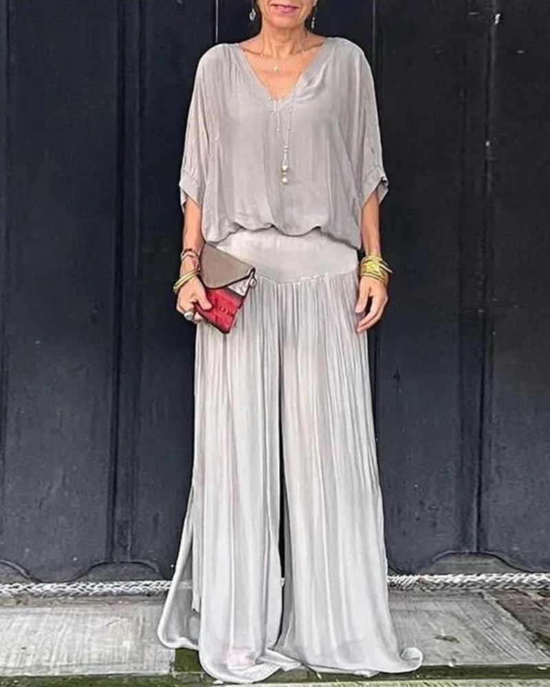 Jumpsuit feminino fluido com corte elegante, oferecendo conforto e estilo para o look dia a dia. Roupa versátil.