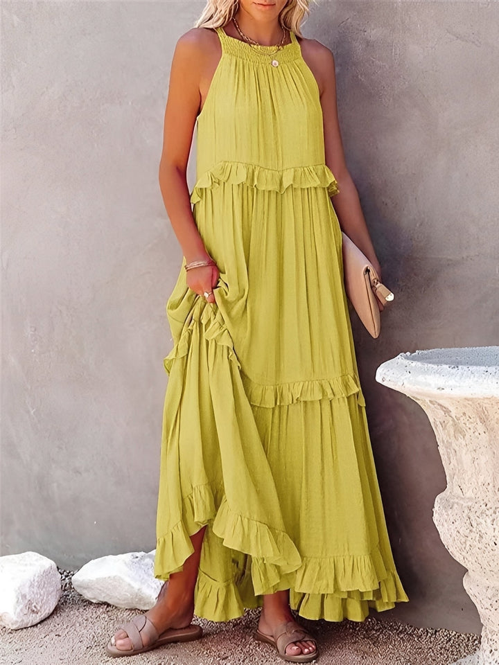Deslumbrante vestido feminino Zanna com babados. Sem mangas, ideal para um verão casual ou festa elegante.