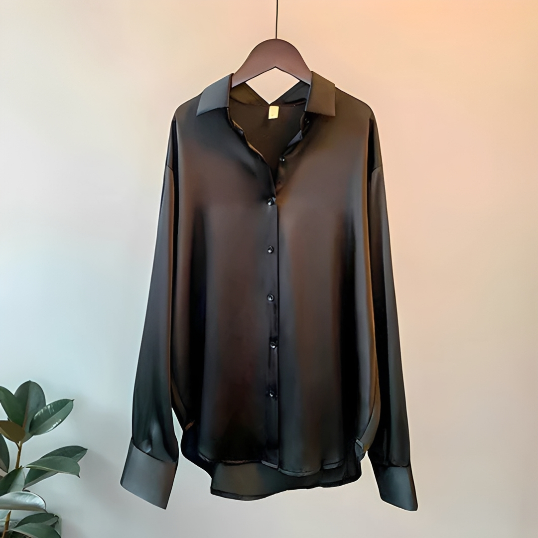 Top feminino brilhante com manga longa, estilo elegante e confortável, ideal para looks casuais e sociais.
