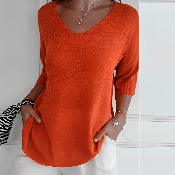 Suéter feminino longo elegante e confortável. Ideal para moda outono/inverno casual.