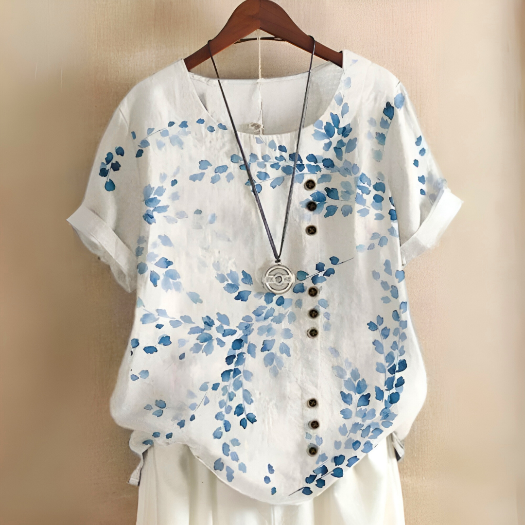 Blusa feminina casual com estampa de folhas verdes, ideal para verão e primavera, manga curta.